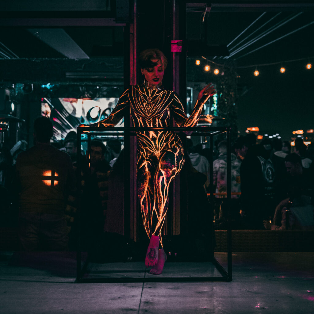 Speciality performer posed with freestanding dance cube
