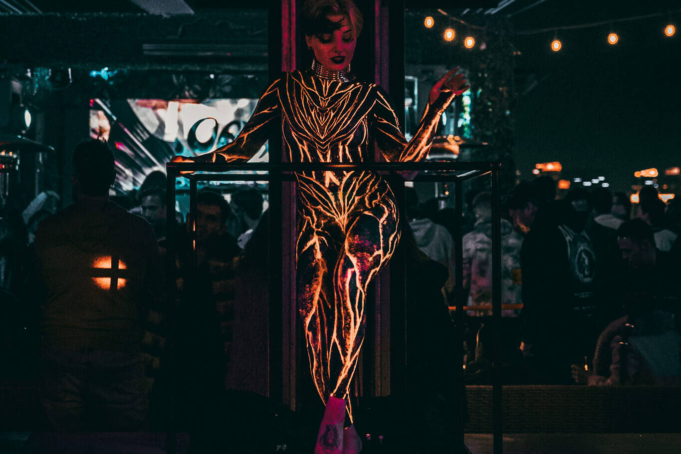 Speciality performer posed with freestanding dance cube