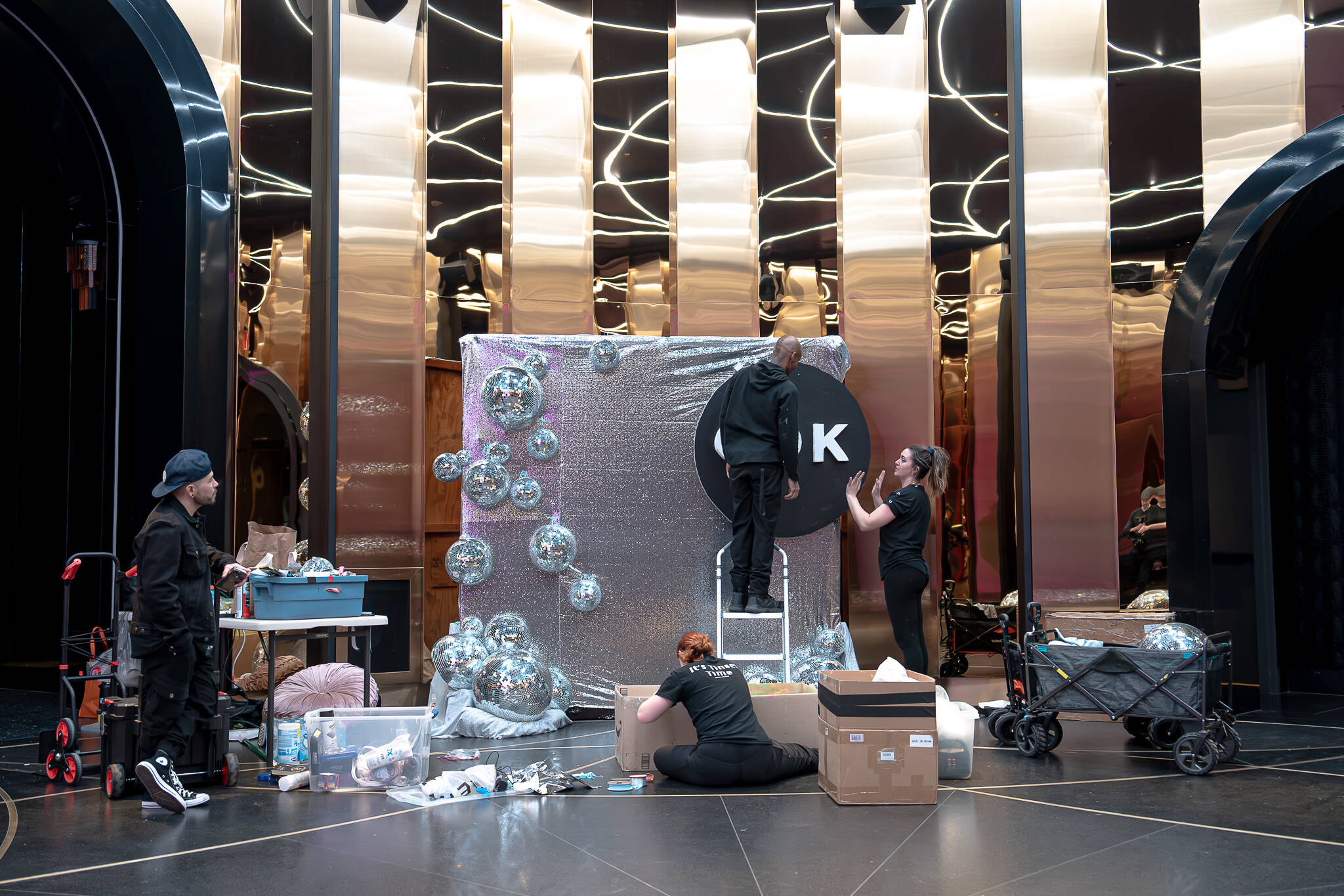 Event production team setting up branded installation for Las Vegas corporate event