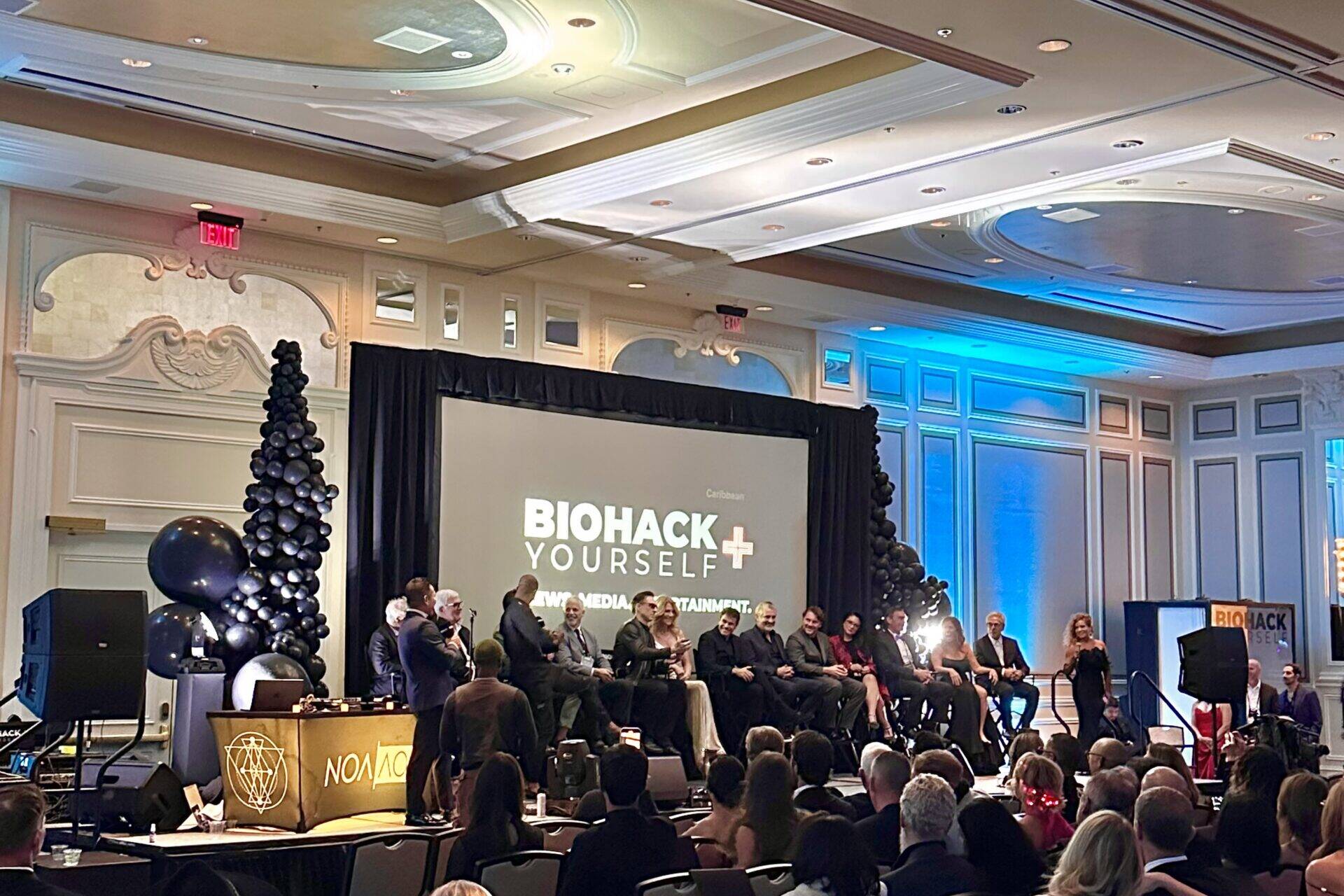 people listening to BioHack presentation at corporate event