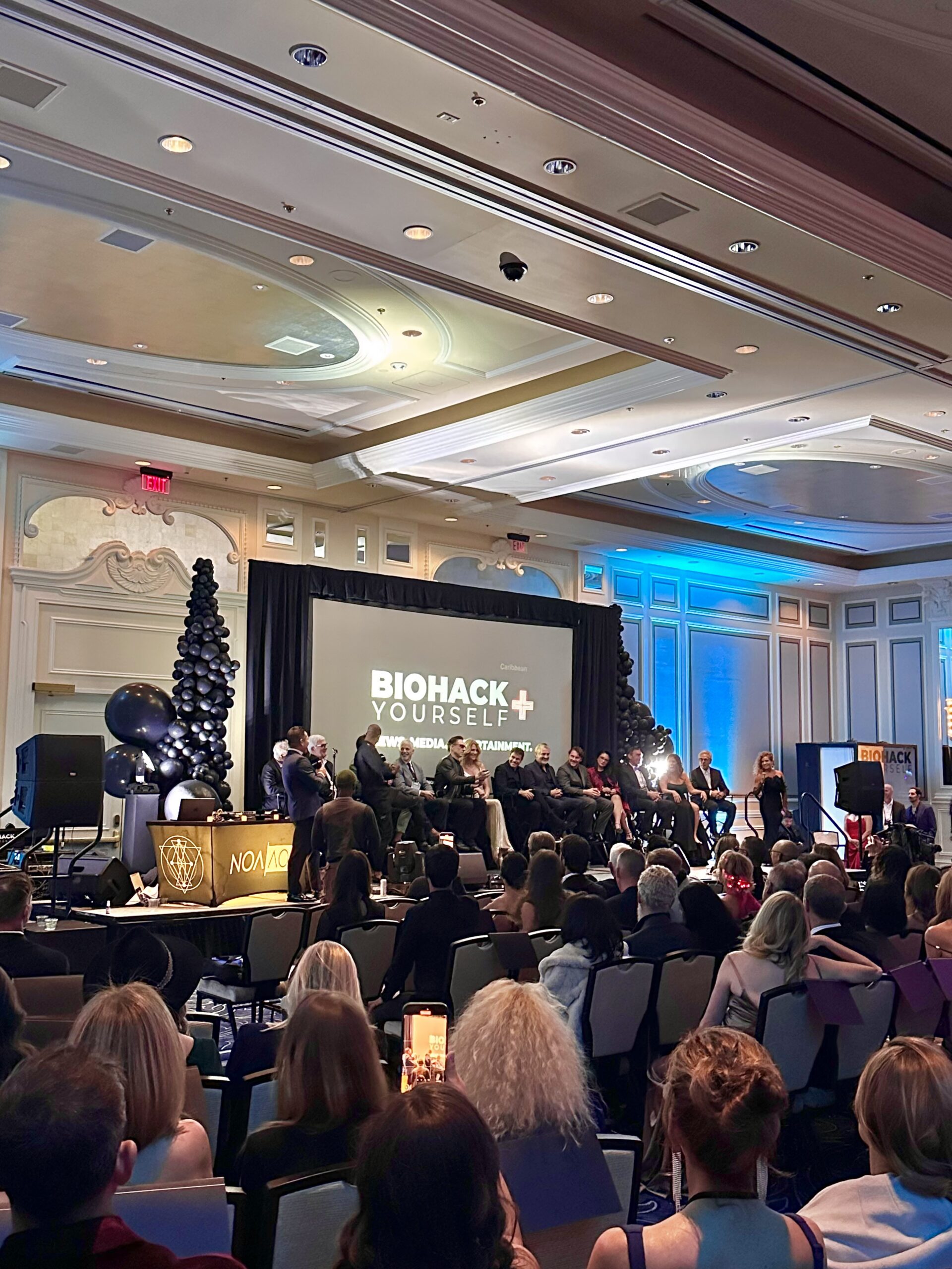 people listening to BioHack presentation at corporate event