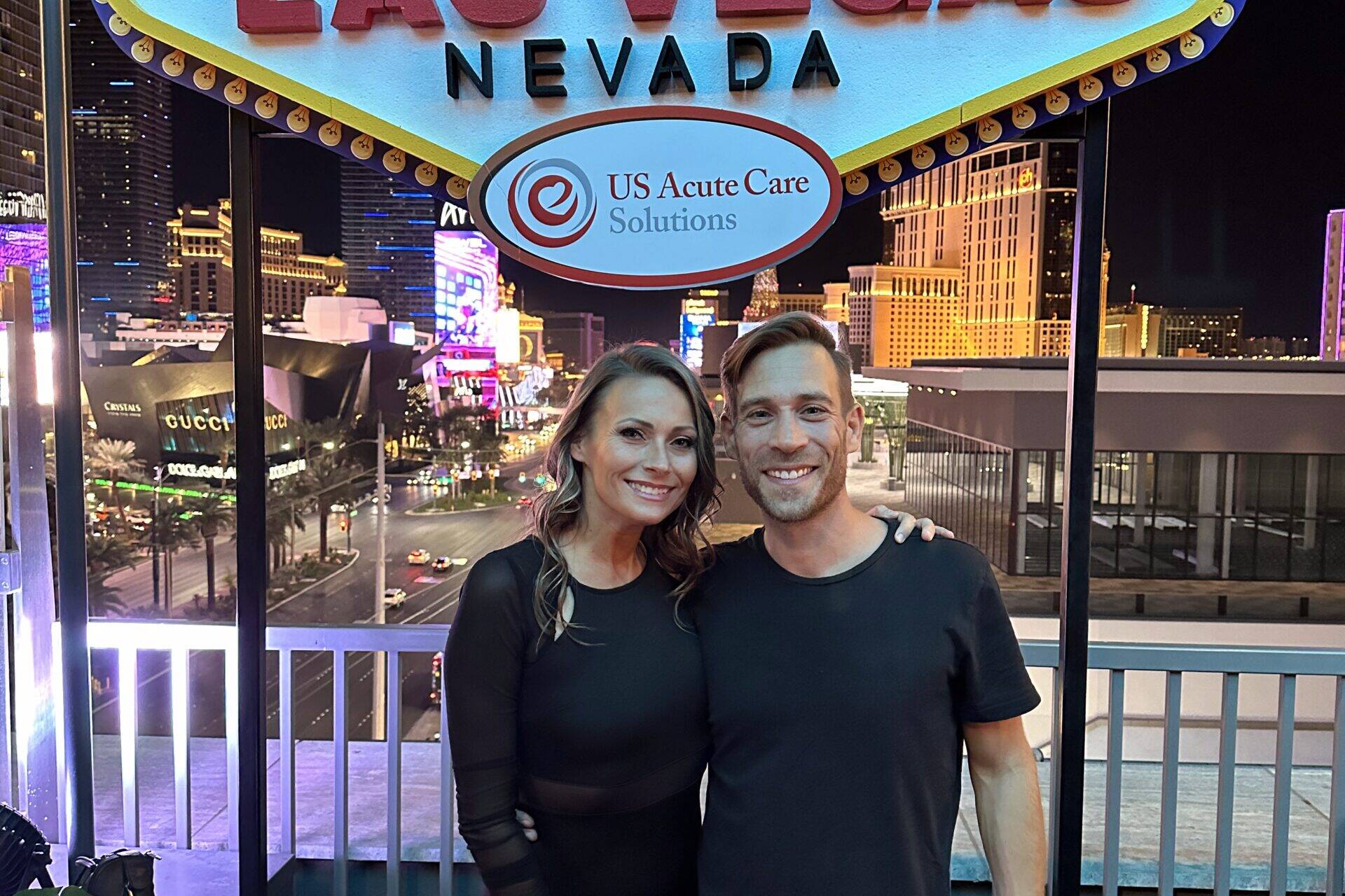 Custom Las Vegas welcome sign photo op setup with branded signage and city skyline backdrop, designed for immersive event decor and guest experiences.