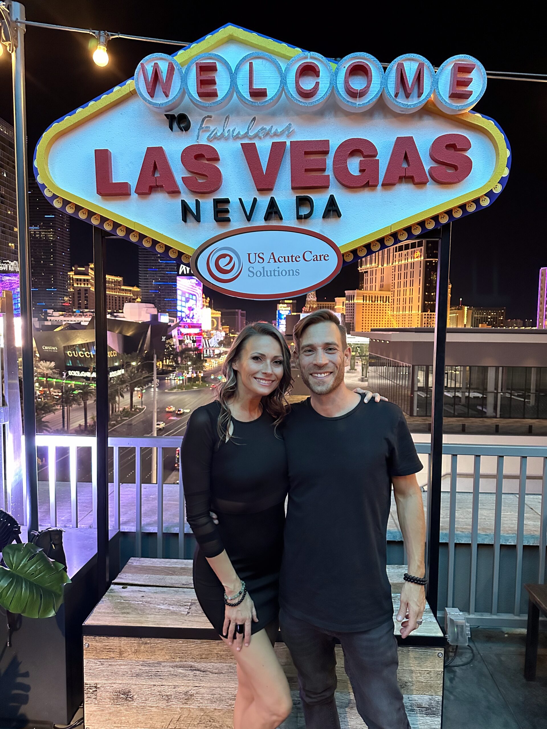 Custom Las Vegas welcome sign photo op setup with branded signage and city skyline backdrop, designed for immersive event decor and guest experiences.