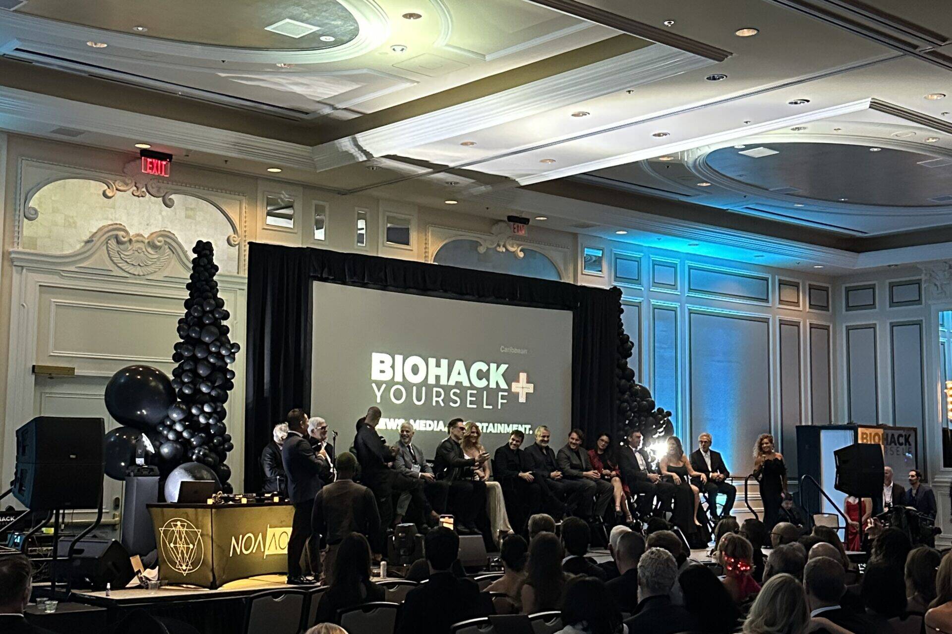 people listening to BioHack presentation at corporate event