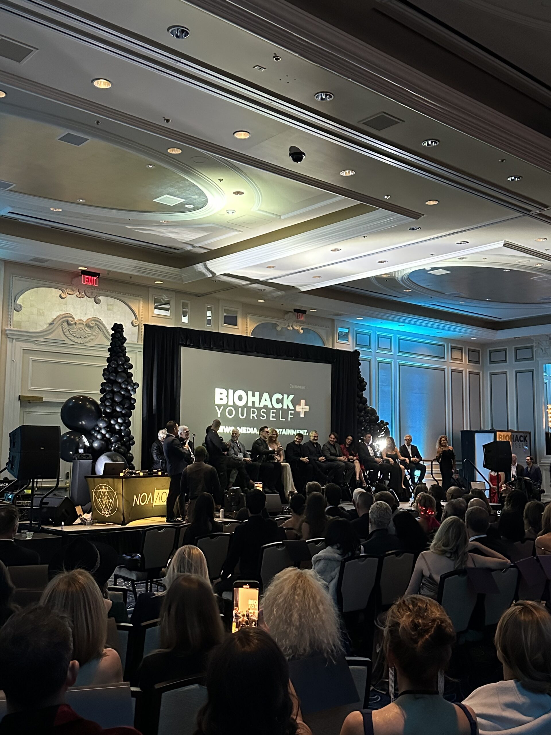 people listening to BioHack presentation at corporate event