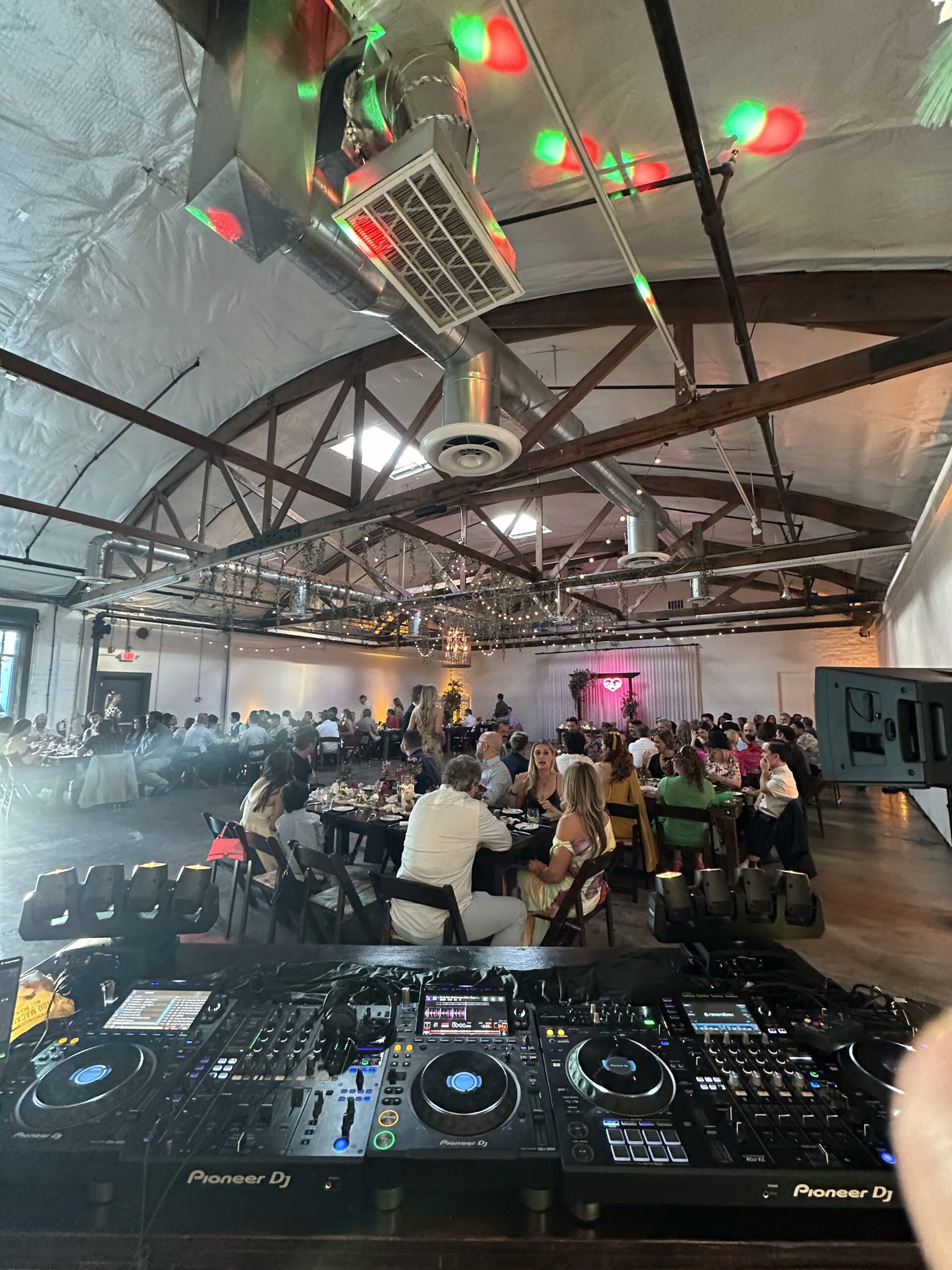 Las Vegas corporate event with DJ, lighting, and crowd at indoor venue