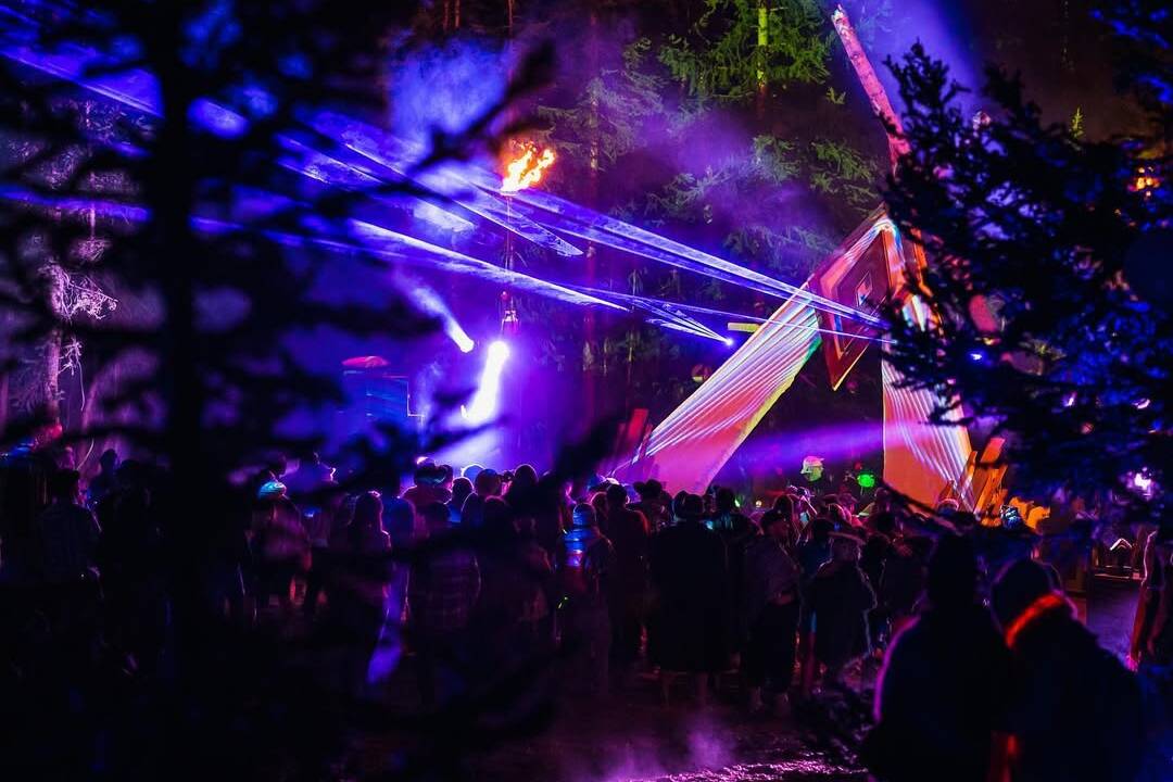 stage and laser set up by Dusk Till Dawn at an outdoor festival