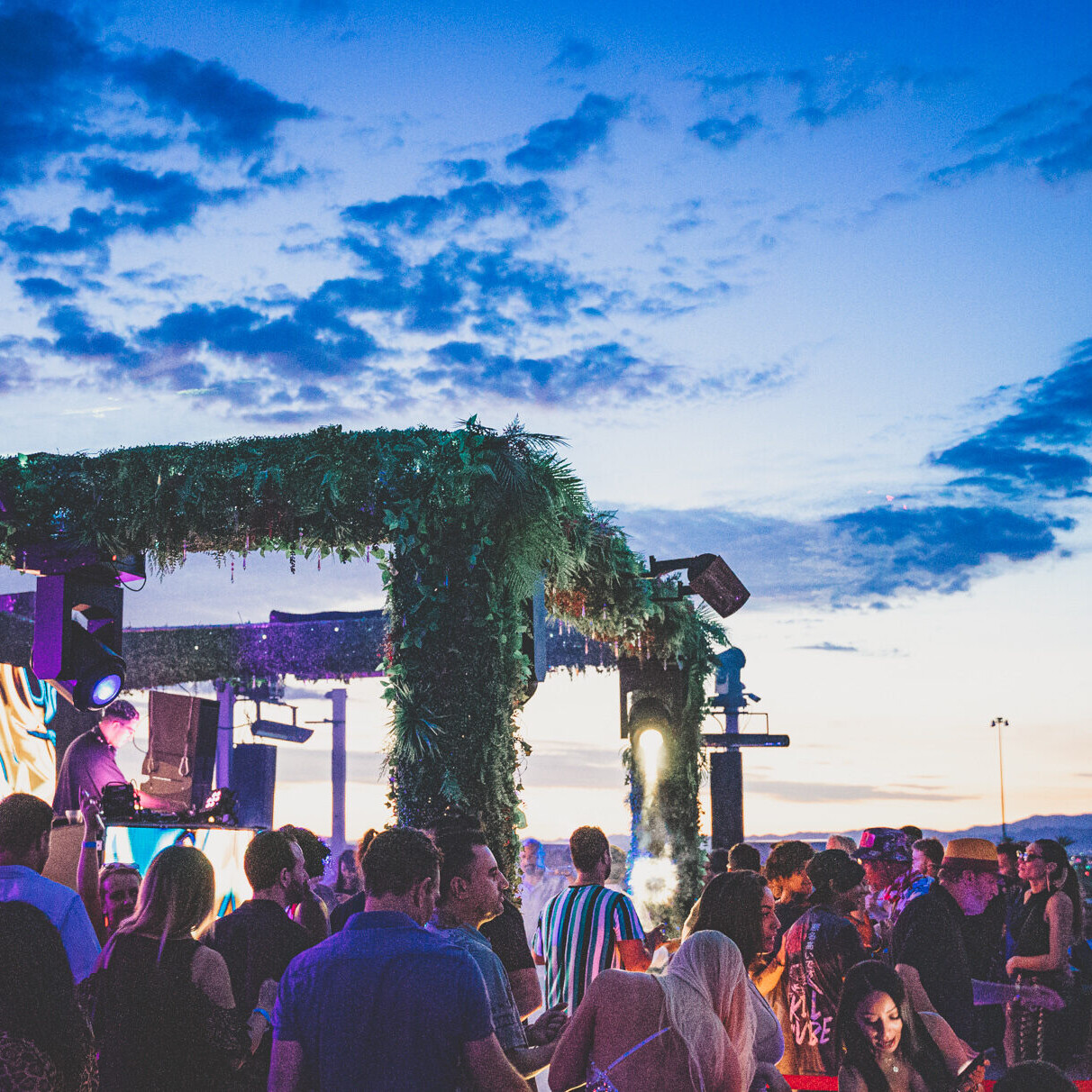 People dancing at Terrace Afterhours stage designed by Dusk Till Dawn at sunrise
