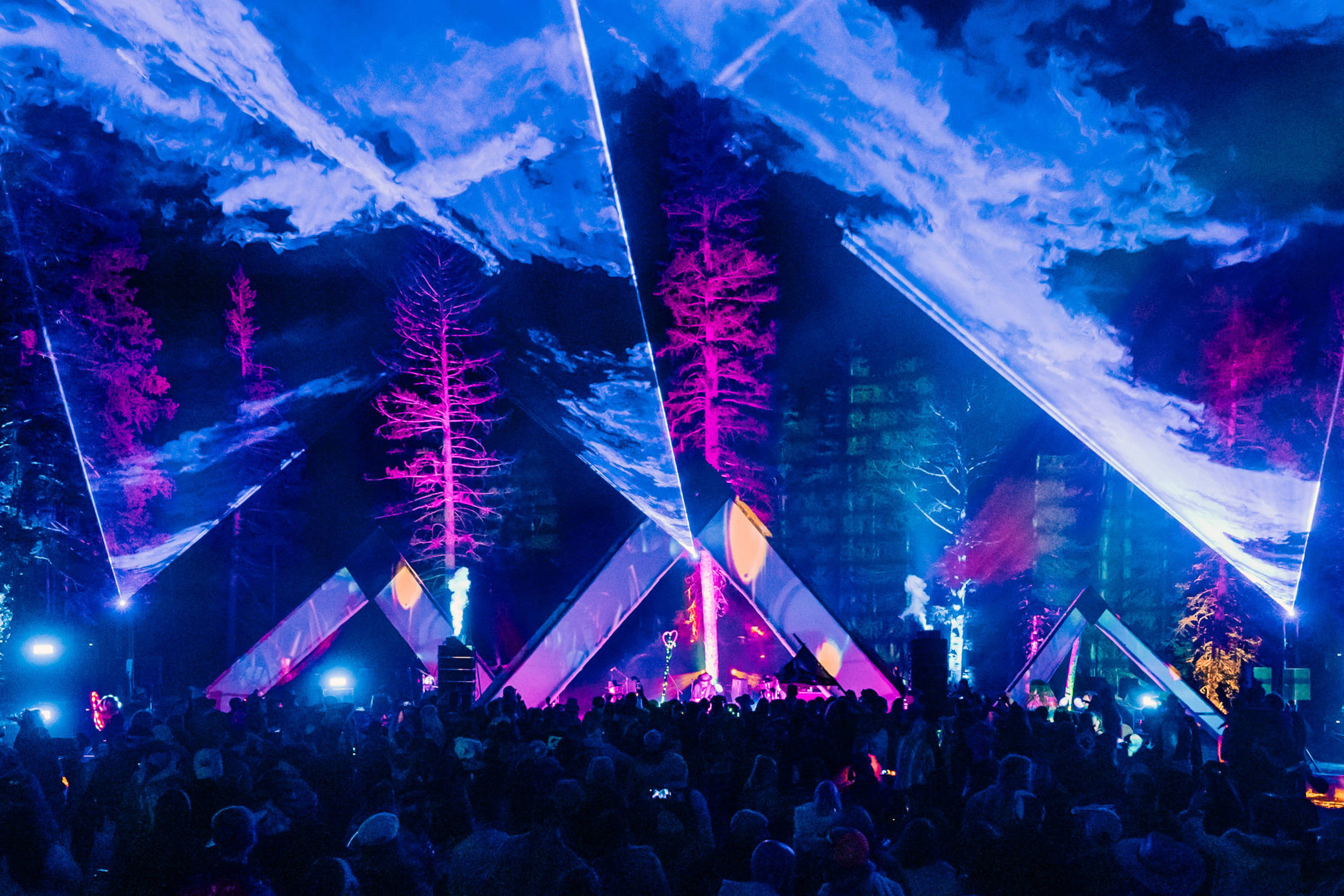High-power laser rental in Las Vegas with beam effects over a live concert crowd
