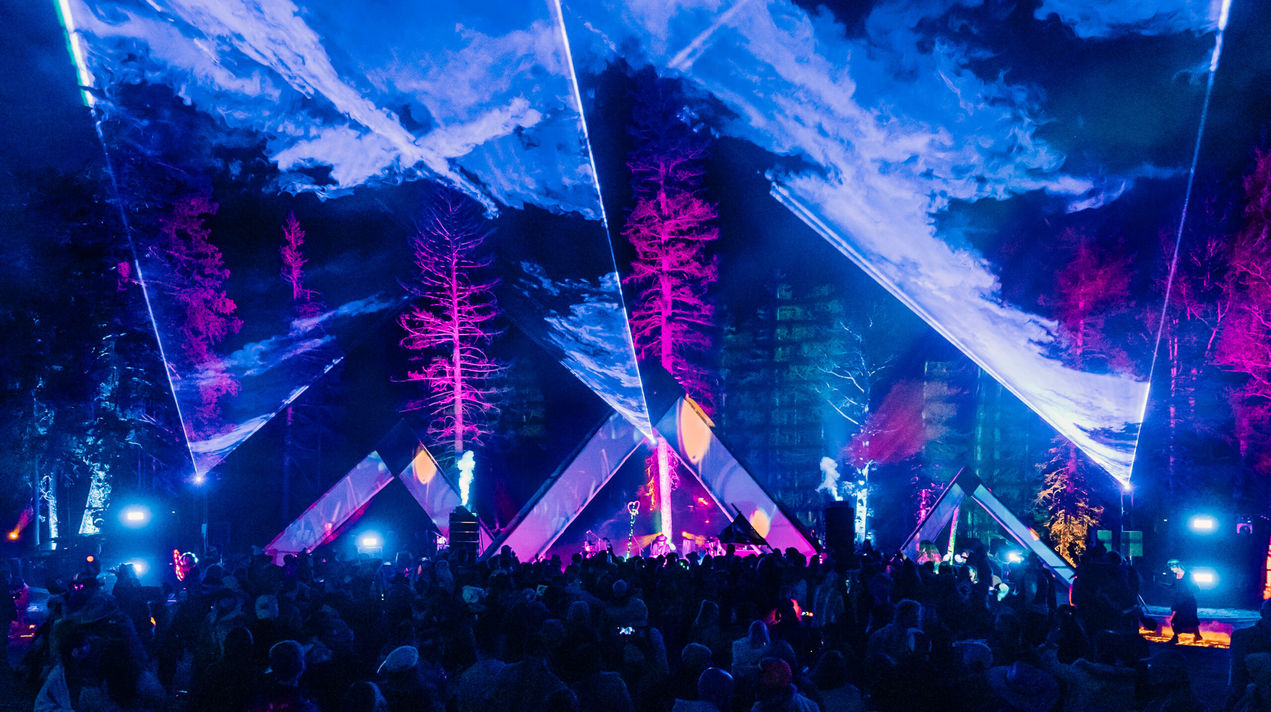 High-power laser rental in Las Vegas with beam effects over a live concert crowd