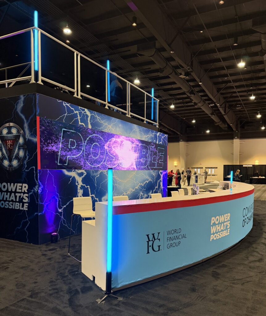 Electric blue lights illuminating trade booth at las vegas convention