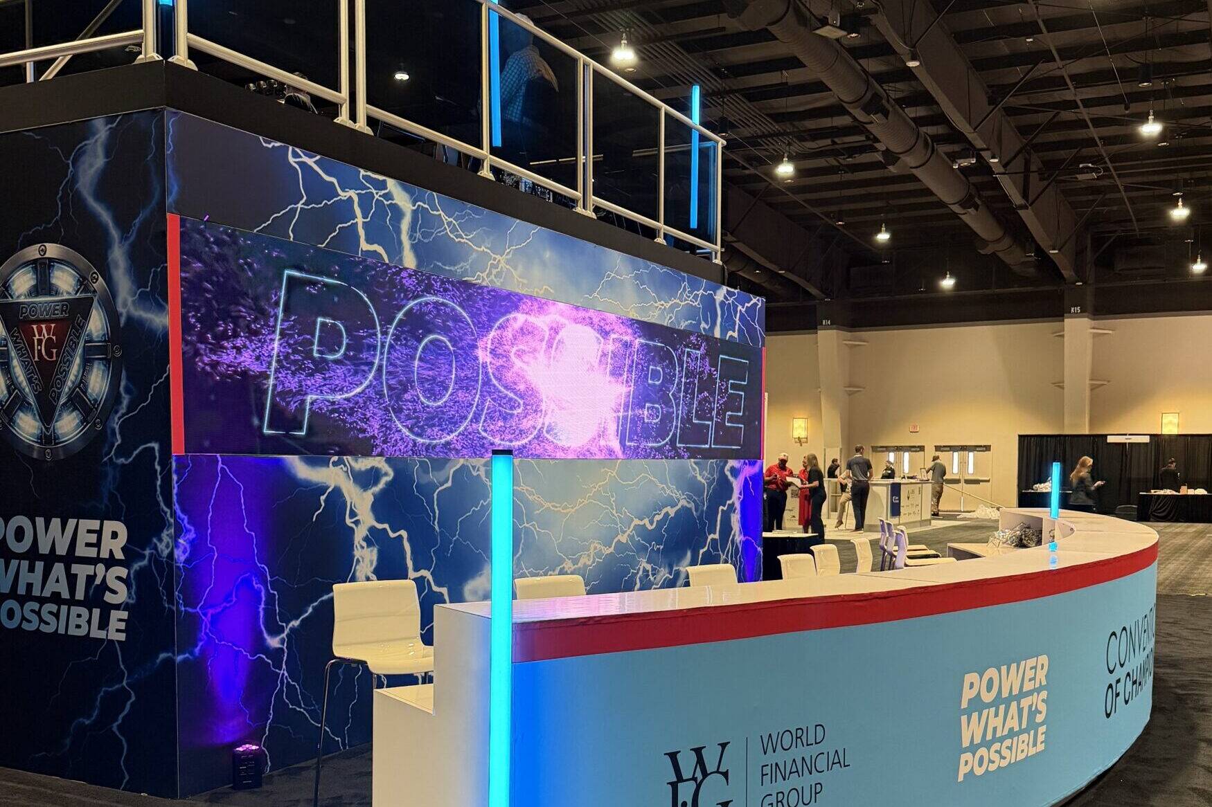 Electric blue lights illuminating trade booth at las vegas convention