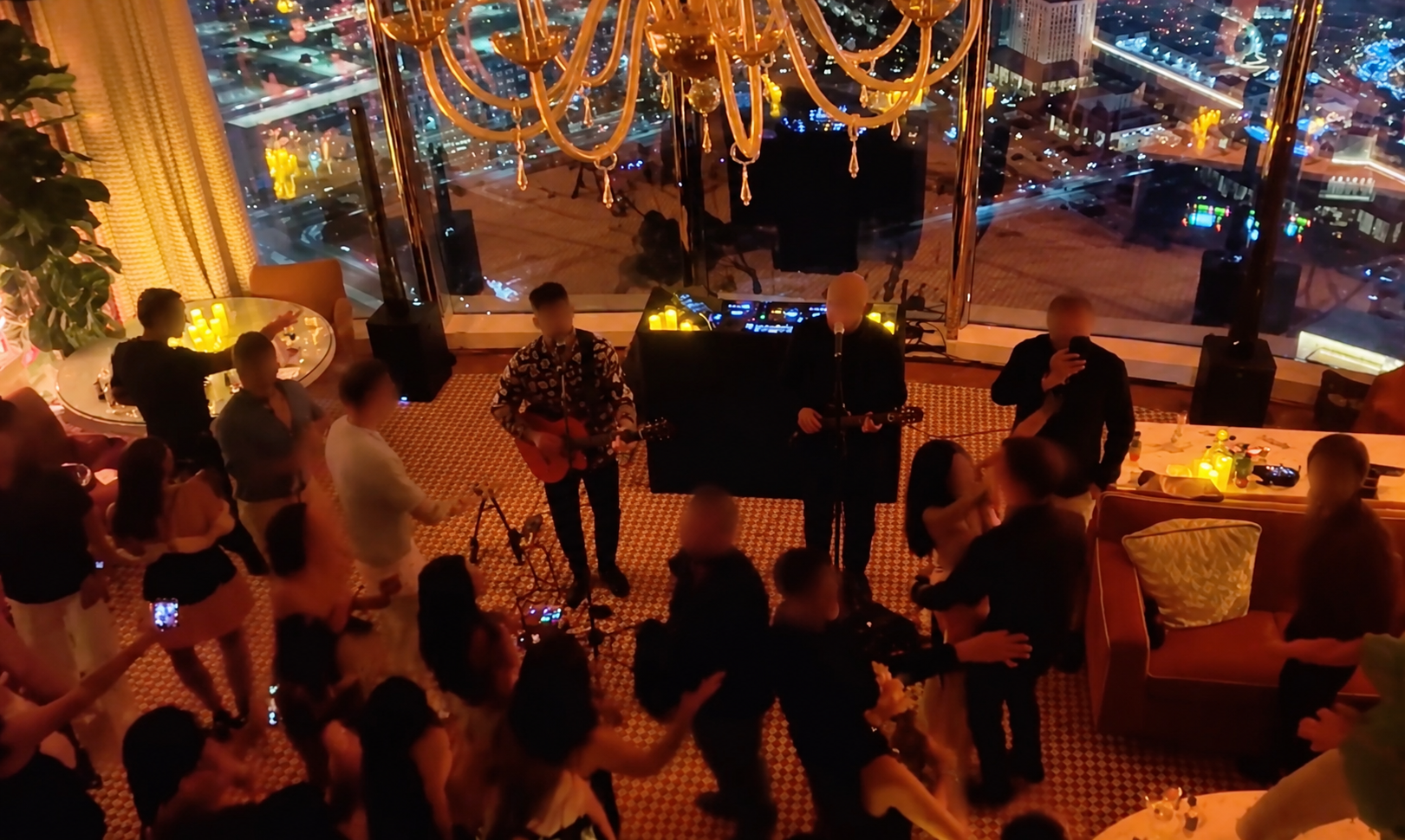People dancing inside private vegas suite with live band