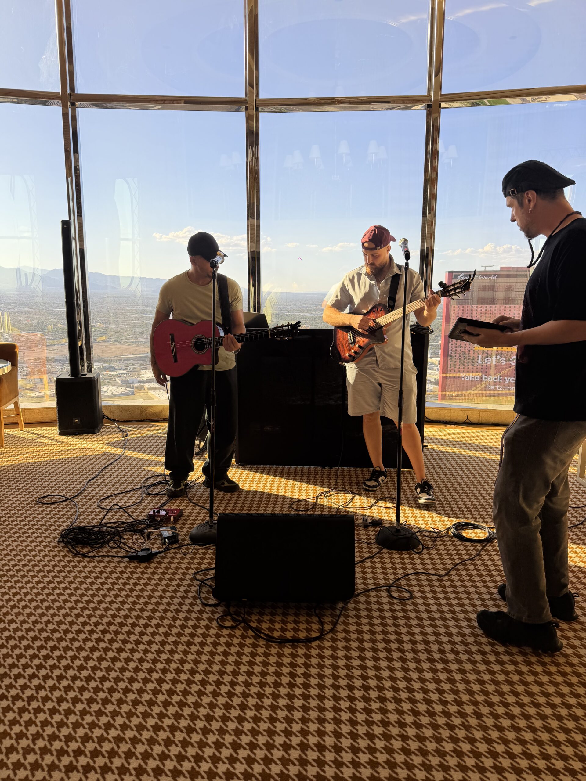Audio engineer performing sound check with band inside of a private las vegas suite